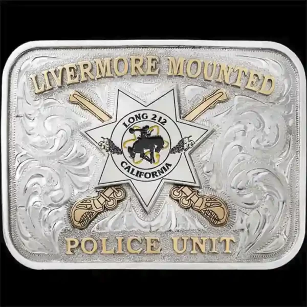 "Celebrate Service with Pride. Our Alameda Belt Buckle is a testament to craftsmanship and tradition, hand-engraved on a German Silver base, it features a striking Jeweler’s Bronze logo detailed with lettering on the top and bottom, and crossed saber